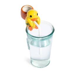 A yellow duck-shaped drink bottle topper with a straw, perched on the rim of a clear glass filled with water.