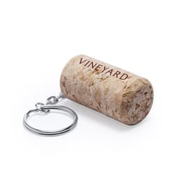 A cork-shaped keyring in beige with a metallic keychain attachment, featuring a logo design.
