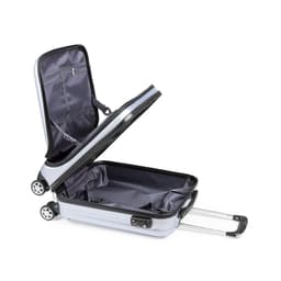 A wheeled grey trolley bag with a spacious interior and retractable handle, featuring a zipper and wheels.