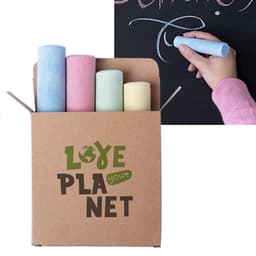 A box containing four pieces of chalk in pink, green, yellow, and blue, alongside a hand using chalk on a blackboard.