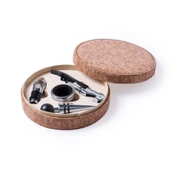 A cork-finished gift box contains wine accessories, including a corkscrew, pourer, and stopper.