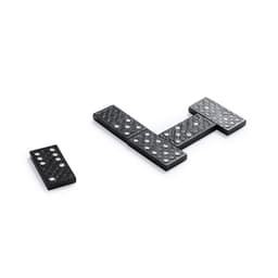 A set of black dominoes arranged in a game formation, featuring raised dots and a textured surface.