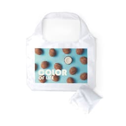A foldable bag in white featuring a colourful design with nuts on a blue background. Comes with a matching compact pouch.