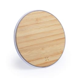 A circular wireless charger with a bamboo surface and a silver rim. It has a sleek, modern design.