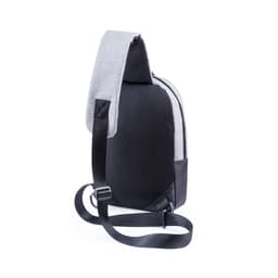 A slingshot bag in grey and black, featuring a textured finish and an adjustable strap. It includes a branding logo.