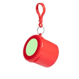 A red keyring featuring a round container with a hook attachment. The container has a green circular area on one side.