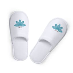 Two white spa slippers with a teal lotus flower design and logo on the upper side.