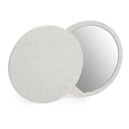 A round, speckled white compact mirror with a reflective surface and a simple clasp design.
