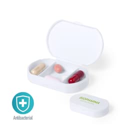 A white antibacterial pillbox featuring four different coloured capsules inside. It has a logo prominently displayed.