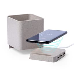 A wireless charging pad in grey with USB ports, alongside a matching grey planter.