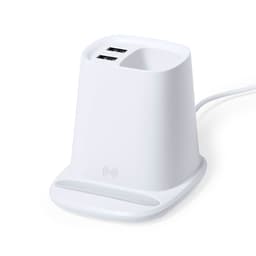 A white multifunction pencil holder with two USB ports and a wireless charging pad at the base.