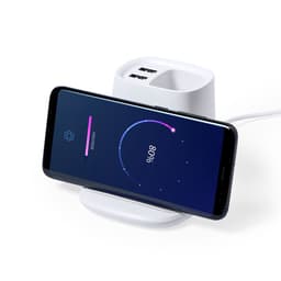 A white multifunction pencil holder with a phone charging on it, featuring two USB ports.