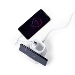 A wireless charger in white with a multifunction pencil holder, featuring two smartphones charging simultaneously.