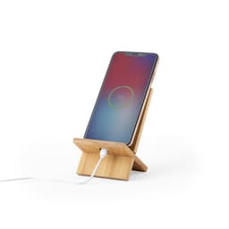 A bamboo phone stand holds a smartphone, displaying a battery charging icon. It features a logo on the base.