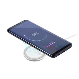 A wireless charger in a sleek design with a smartphone showing battery charging status. The charger has a minimalistic appearance.