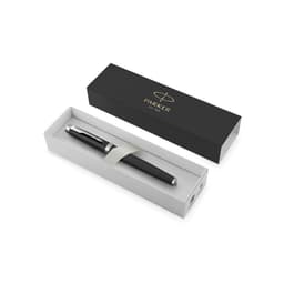 A metal pen in a black box, featuring a silver clip and branding, displayed in a white interior.