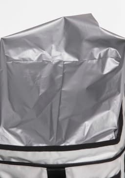 A grey insulated cooler bag with a zip closure and a waterproof interior liner. It features a black trim and handle.