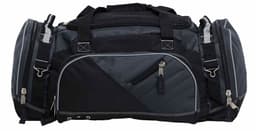 A duffle bag in dark grey and black, featuring multiple compartments and zippers, along with sturdy handles.