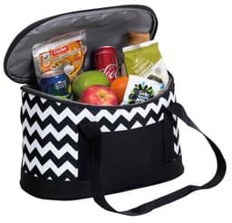 A cooler bag in black and white chevron design, filled with drinks, snacks, fruit, and a bottle. Features dual handles.