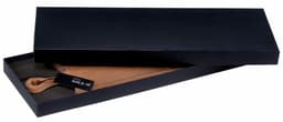 A wooden serving board in a black gift box, featuring a handle and branded tag.