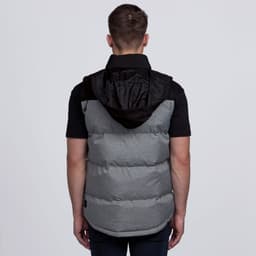 A padded puffa vest in grey with a black hood, featuring a logo on the side.