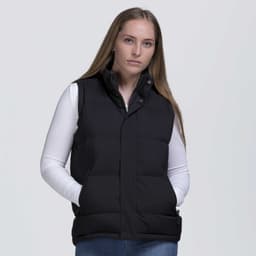 A black puffa vest with a high collar and side pockets, worn by a model against a plain background.