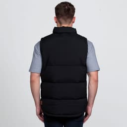 A black puffa vest with a high collar, viewed from the back, worn over a grey t-shirt. Features a logo.