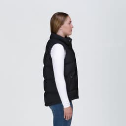 A side view of a black puffa vest with a high collar and zippered pockets, featuring a logo.
