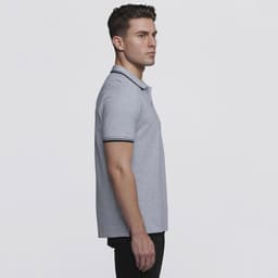A grey polo shirt with contrasting stripes on the collar and sleeves, featuring a logo.