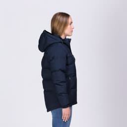 A navy puffer jacket with a hood, featuring a zip and pockets, displayed on a model from the side.