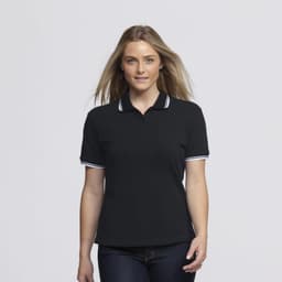 A woman in a black polo shirt with white trim, featuring a logo on the chest. She has long hair styled down.