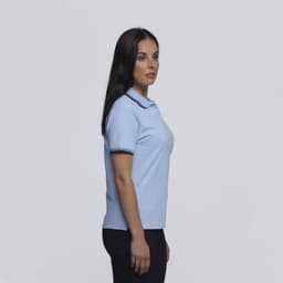 A light blue women's polo shirt with contrasting stripes on the collar, featuring a logo.