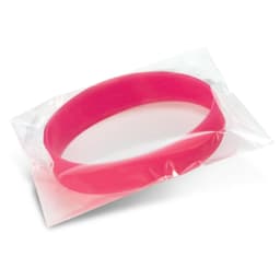 A pink silicone wristband displayed in clear packaging, featuring a logo.