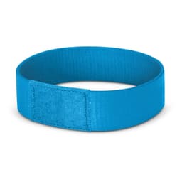 A blue wristband with a smooth finish and a branding logo, designed for events and exhibitions.