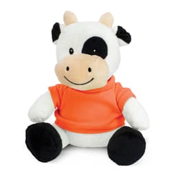 A plush cow toy featuring black and white fur, wearing an orange shirt, with a friendly smile.