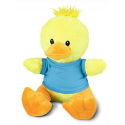 A yellow duck plush toy with orange feet and a blue shirt, featuring a tuft of hair on top.