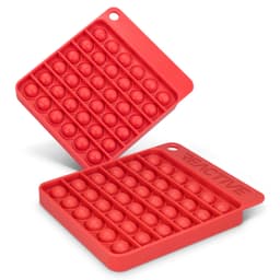 A red silicone Pop Bubble Board featuring a grid of bubbles in a square shape, with one board stacked on top of another.