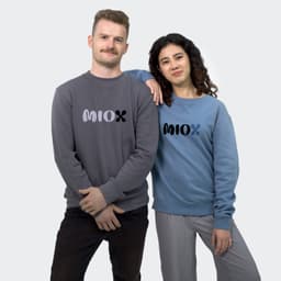 A grey unisex sweatshirt worn by a man and a blue unisex sweatshirt worn by a woman, both featuring a logo.