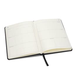 An A5 weekly diary in black, featuring cream pages with blank weekly layouts and a ribbon marker.