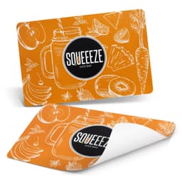 A full colour orange place mat featuring fruit illustrations, with a logo prominently displayed in the centre.