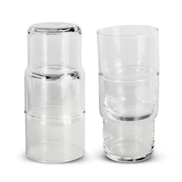 A set of clear glass tumblers stacked together, featuring a sleek and modern design. Each tumbler has a smooth finish.