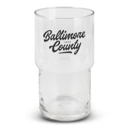 A clear stackable glass tumbler featuring a black logo. The glass has a cylindrical shape with a wider base.