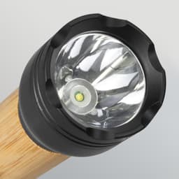 A bamboo torch with a black head and a clear lens, featuring a single LED light in the centre.