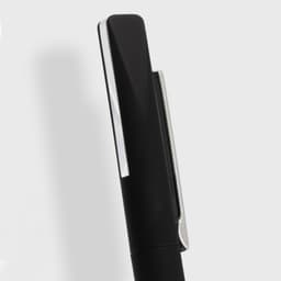 A black metal pen with a shiny silver clip, featuring a sleek and elegant design. It has a branding logo.