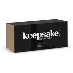 A black and brown box with 'keepsake' branding, containing a watering can from the Keepsake collection.