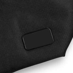 A black cooler made from textured material, featuring a rectangular logo or branding area.