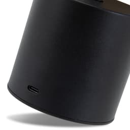 A black rechargeable table lamp with a USB-C charging port at the base, featuring a sleek cylindrical design.