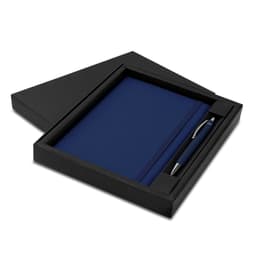 A navy blue notebook and pen set displayed in a sleek black gift box. The box features a simple design and contains a logo.