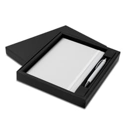 A black gift box containing a white notebook and a silver pen. The set is elegantly presented for gifting.