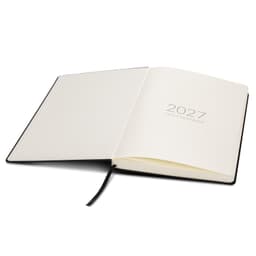 An open A4 diary with a black cover and blank pages, featuring the year "2027" printed on the inside.